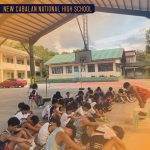 Programs 40 Students sitting on the basketball court at New Cabalan National High School.