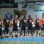 Programs 23 Subic Bay Baptist Ministries basketball team standing on the court.