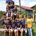 Programs 29 Group of young boys and a coach in basketball uniforms outdoors at Subic Bay Baptist Ministries.