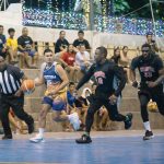 Programs 24 Playing basketball game at Subic Bay Baptist Ministries sports event, with spectators watching from.